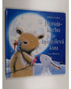 Kirjailijan Tim Warnes & Gillian Lobel käytetty kirja Hunajakarhu ja hymyilevä kuu