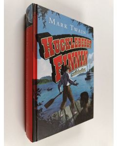 Kirjailijan Mark Twain käytetty kirja Huckleberry Finnin seikkailut