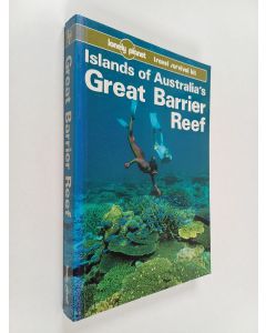 Kirjailijan Tony Wheeler käytetty kirja Islands of Australia's Great Barrier Reef