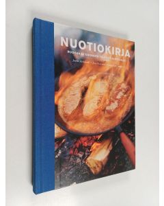 Kirjailijan Jaakko Heinimäki käytetty kirja Nuotiokirja : ruokaa ja tarinoita tuleen tuijottajille