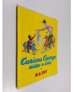 Kirjailijan Hans Augusto Rey käytetty kirja Curious George Rides a Bike