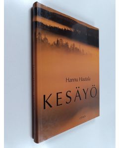 Kirjailijan Hannu Hautala käytetty kirja Kesäyö : hetkiä pohjoisessa valossa