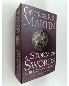 Kirjailijan George R. R. Martin käytetty kirja A storm of swords : Part two : Blood and gold