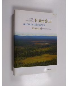 Kirjailijan Seppo Saraspää käytetty kirja Eräretkiä valon ja hämärän maassa : valitut tarinat