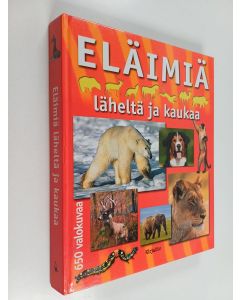 Kirjailijan Genevieve Warnau käytetty kirja Eläimiä läheltä ja kaukaa