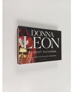 Kirjailijan Donna Leon käytetty kirja Kasvot kuvassa : Komisario Guido Brunettin tutkimuksia (Miki-kirja)