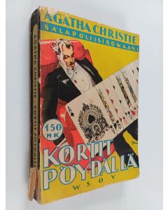 Kirjailijan Agatha Christie käytetty kirja Kortit pöydällä