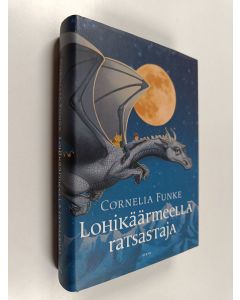 Kirjailijan Cornelia Funke käytetty kirja Lohikäärmeellä ratsastaja (ERINOMAINEN)