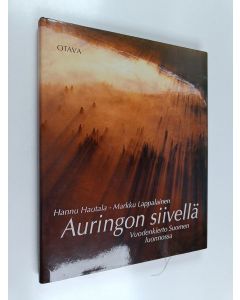 Kirjailijan Hannu Hautala & Markku Lappalainen käytetty kirja Auringon siivellä : Vuodenkierto Suomen luonnossa