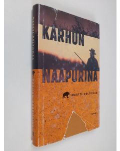 Kirjailijan Martti Peltomaa käytetty kirja Karhun naapurina : pyytötarinoita