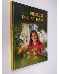 Kirjailijan Eija Klaucke käytetty kirja Pienessä puutarhassa : unelmien täyttymyksiä