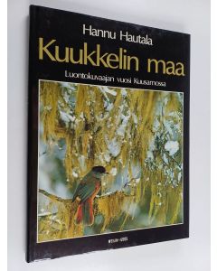 Kirjailijan Hannu Hautala käytetty kirja Kuukkelin maa : luontokuvaajan vuosi Kuusamossa