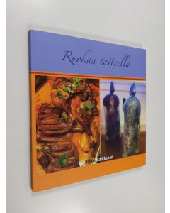 Kirjailijan Heikki Markkanen käytetty kirja Ruokaa taiteella (ERINOMAINEN)