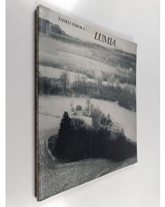 Kirjailijan Taneli Eskola käytetty kirja Lumia : 32 valokuvaa = Snows : 32 photographs