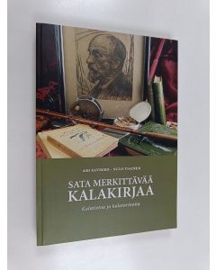 Kirjailijan Ari Savikko käytetty kirja Sata merkittävää kalakirjaa : kalatietoa ja kalatarinoita : noin sata vuotta kalastusta Suomesta