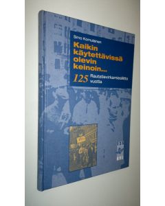 Kirjailijan Simo Komulainen käytetty kirja Kaikin käytettävissä olevin keinoin : Rautatievirkamiesliitto 125 vuotta : kokouksia, sopimustoimintaa ja tapahtumia 1973-1997