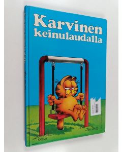 Kirjailijan Jim Davis käytetty kirja Karvinen keinulaudalla