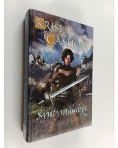 Kirjailijan Kristin Cashore käytetty kirja Syntymälahja