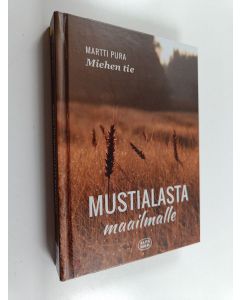 Kirjailijan Martti Pura käytetty kirja Miehen tie : Mustialasta maailmalle