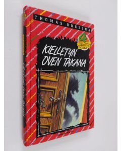 Kirjailijan Thomas Brezina käytetty kirja Kielletyn oven takana