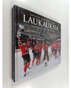 Kirjailijan Jukka Rautio & Marko Leppänen ym. käytetty kirja Laukauksia 2012-2013 : liigakausi 2012-2013 kuvina