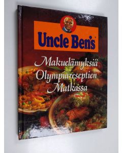 Kirjailijan Michele Olivier käytetty kirja Makuelämyksiä olympiareseptien matkassa