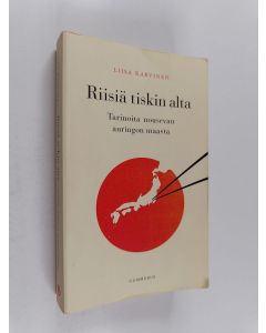 Kirjailijan Liisa Karvinen käytetty kirja Riisiä tiskin alta : tarinoita nousevan auringon maasta