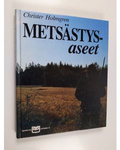 Kirjailijan Christer Holmgren käytetty kirja Metsästysaseet