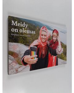 Kirjailijan Anne Kalliola käytetty kirja Meidy on olemas olemas : Karjalazet nuoret Suomes