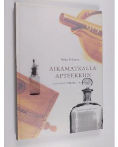 Kirjailijan Reino Eriksson käytetty kirja Aikamatkalla apteekkiin : Iisalmen I apteekki 1857-2007
