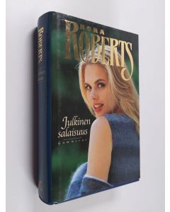 Kirjailijan Nora Roberts käytetty kirja Julkinen salaisuus