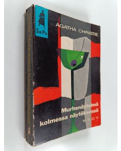 Kirjailijan Agatha Christie käytetty kirja Murhenäytelmä kolmessa näytöksessä