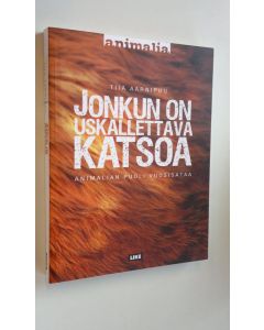 Kirjailijan Tiia Aarnipuu uusi kirja Jonkun on uskallettava katsoa : Animalian puoli vuosisataa (UUDENVEROINEN)