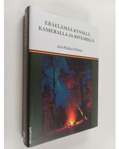 Kirjailijan Ari-Pekka Palmu käytetty kirja Eräelämää kynällä, kameralla ja kiväärillä