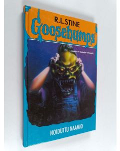 Kirjailijan R. L Stine käytetty kirja Noiduttu naamio