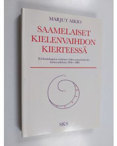 Kirjailijan Marjut Aikio käytetty kirja Saamelaiset kielenvaihdon kierteessä (tekijän omiste) : kielisosiologinen tutkimus viiden saamelaiskylän kielenvaihdosta 1910-1980