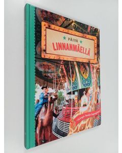 Kirjailijan Katariina Heilala käytetty kirja Päivä Linnanmäellä : "Helsingin hauskin kaupunginosa"