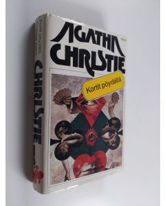 Kirjailijan Agatha Christie käytetty kirja Kortit pöydällä / Syyttävä sormi