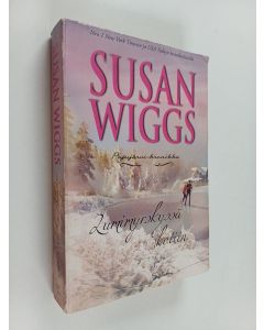 Kirjailijan Susan Wiggs käytetty kirja Lumimyrskyssä kotiin