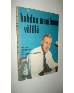 Kirjailijan Jukka / Alma Holopainen käytetty kirja Kahden maailman välillä