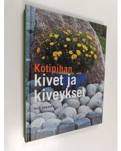 Kirjailijan Nils Skaarer käytetty kirja Kotipihan kivet ja kiveykset