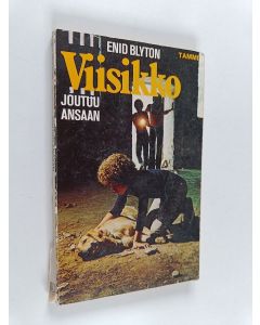 Kirjailijan Enid Blyton käytetty kirja Viisikko joutuu ansaan