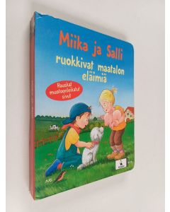 Kirjailijan Klaus Bliesener käytetty kirja Miika ja Salli ruokkivat maatalon eläimiä