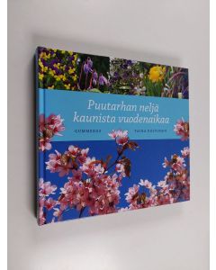 Kirjailijan Taina Koivunen käytetty kirja Puutarhan neljä kaunista vuodenaikaa