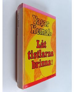 Kirjailijan Yaşar Kemal käytetty kirja Låt tistlarna brinna!