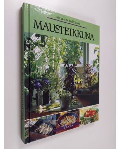 Kirjailijan Marguerite Walfridson käytetty kirja Mausteikkuna : yrttejä ja mausteita sekä yrteillä maustettua ruokaa