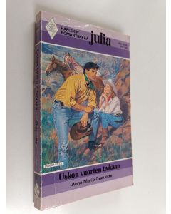 Kirjailijan Anne Marie Duquette käytetty kirja Uskon vuorten taikaan