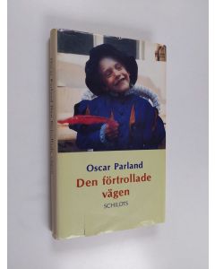 Kirjailijan Oscar Parland käytetty kirja Den förtrollade vägen