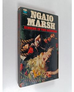 Kirjailijan Ngaio Marsh käytetty kirja Singing in the Shrouds