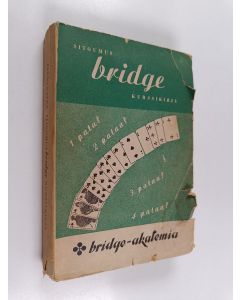 Kirjailijan E. Jannersten käytetty kirja Sitoumus bridge : kurssikirja